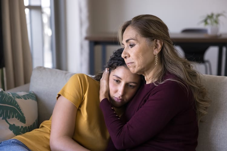 Loving mother hugging, comforting her adult daughter Attachment Issues